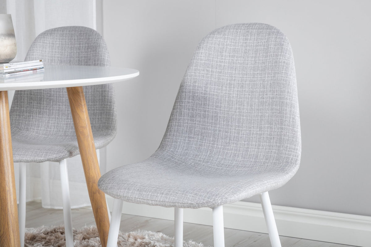 Esszimmerset Plaza mit Tisch aus MDF und Stahlgestell sowie vier Stühlen Polar in Weiss/Grau/Weiss, Ansicht des kompletten Sets.