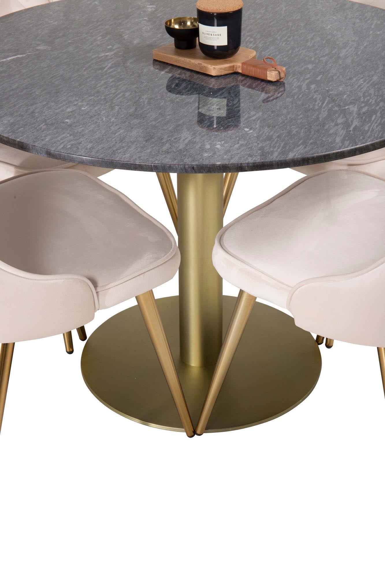 Elegantes Esszimmerset mit rundem Tisch und vier Samtstühlen.