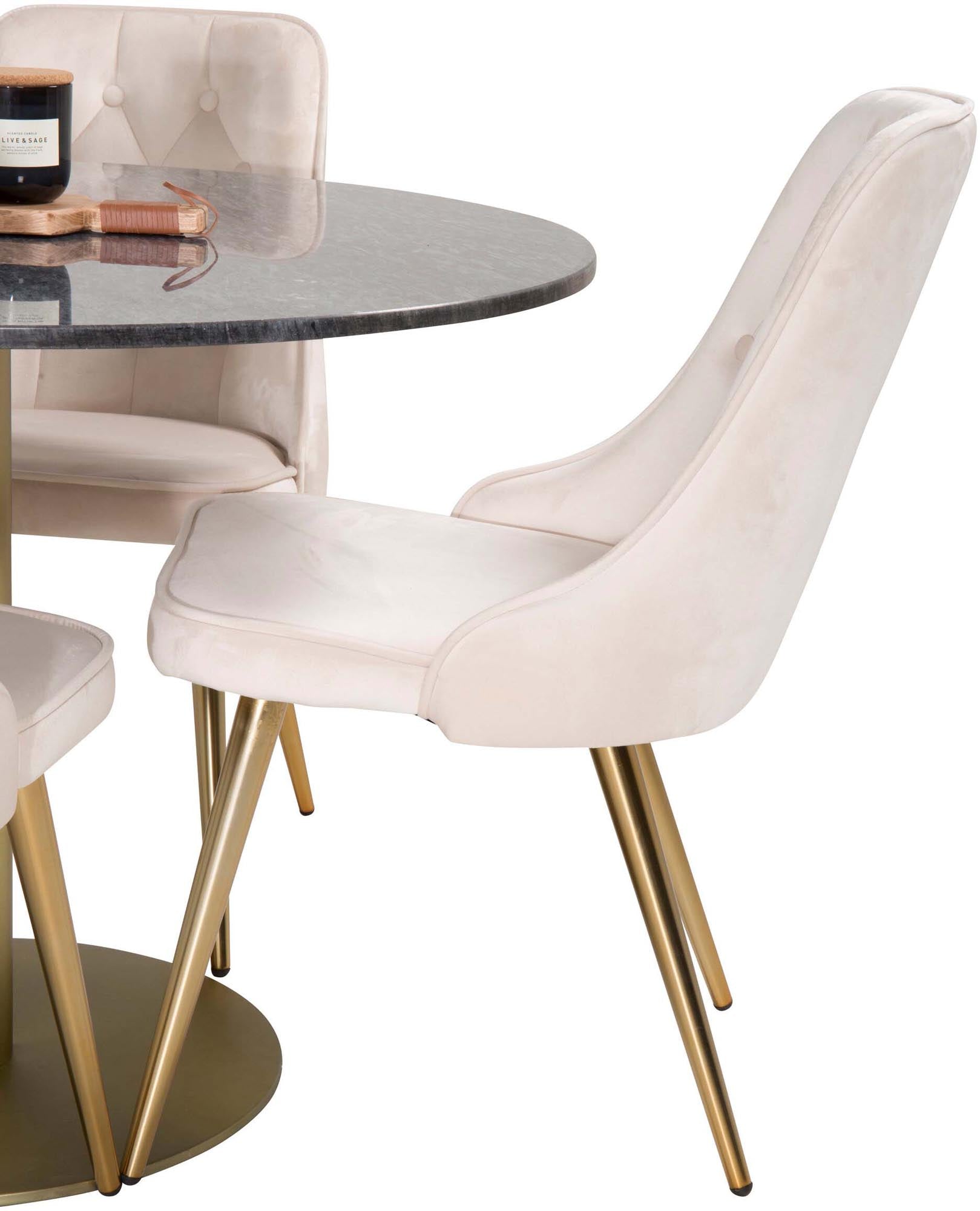 Luxuriöses Esszimmerset mit rundem Tisch und vier Samtstühlen.