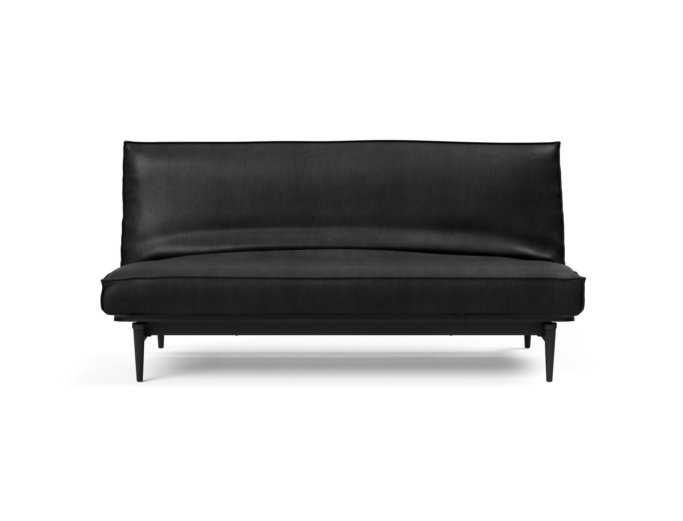 Modernes Bettsofa Colpus 140 in Schwarz mit Eichenakzenten, ideal für vielseitige Nutzung und stilvolle Einrichtung.