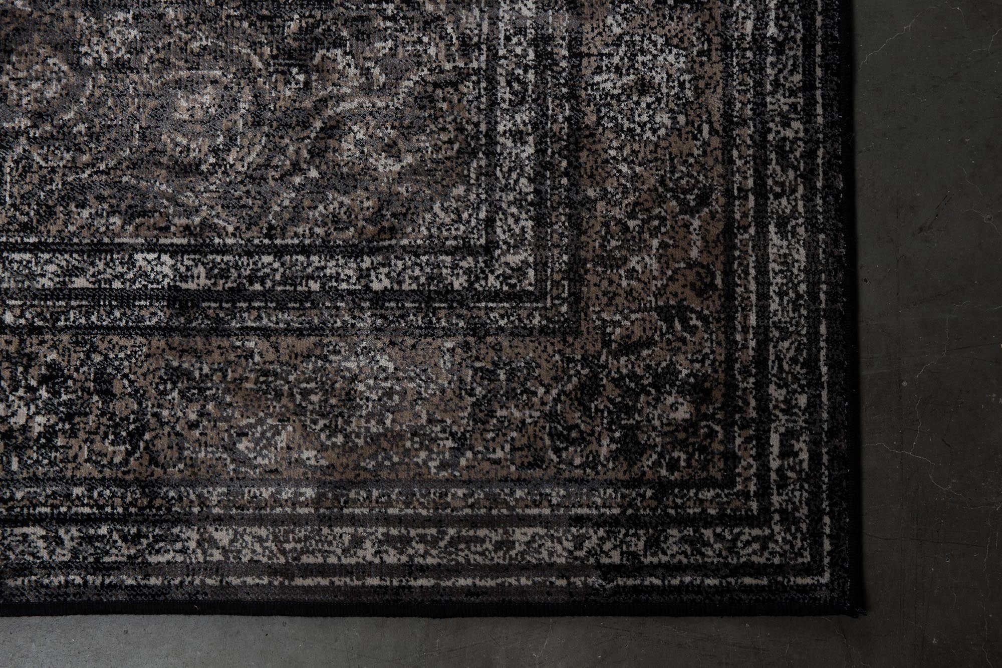 Der Teppich Rugged von Dutchbone besticht durch seinen Vintage-Look und hochwertige Verarbeitung, ideal für jedes Interieur.