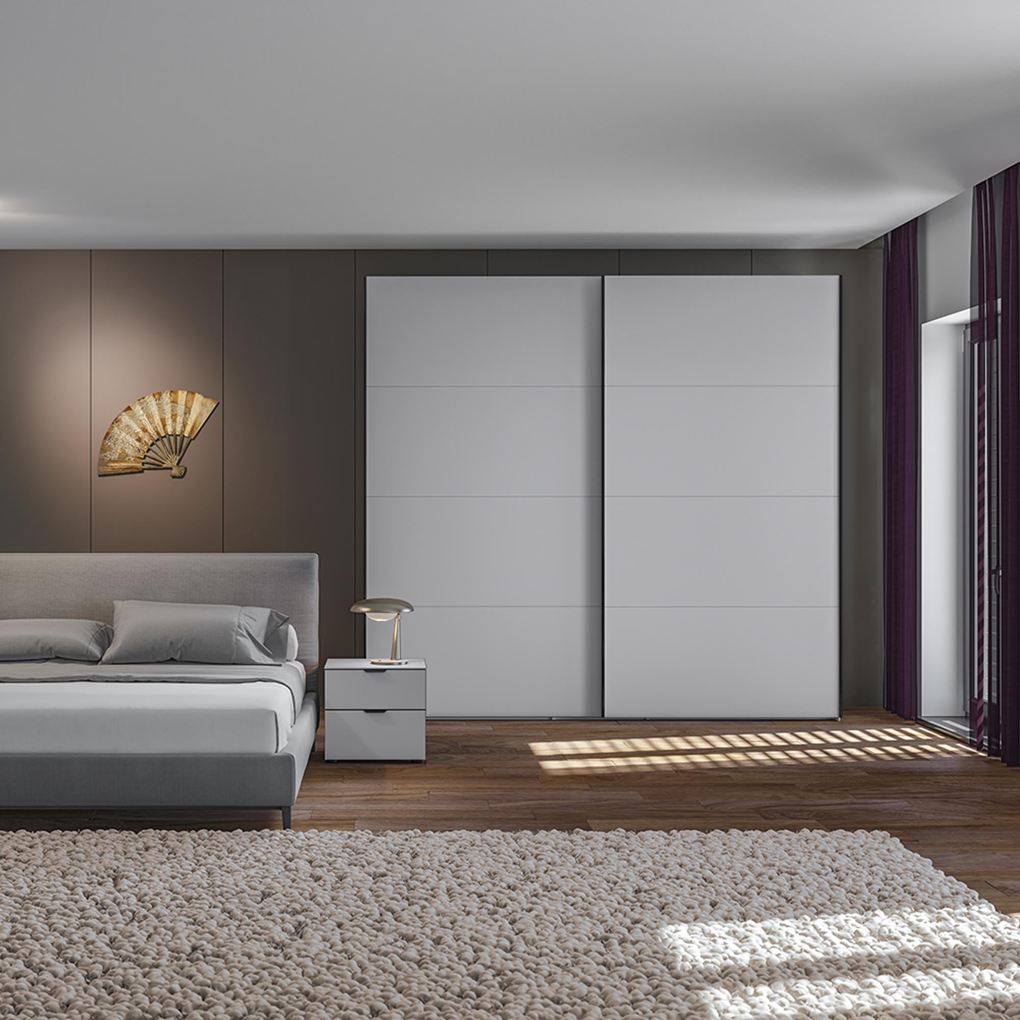 Eleganter Jutzler Schwebetürenschrank M in Premiumweiss mit Zubehör.