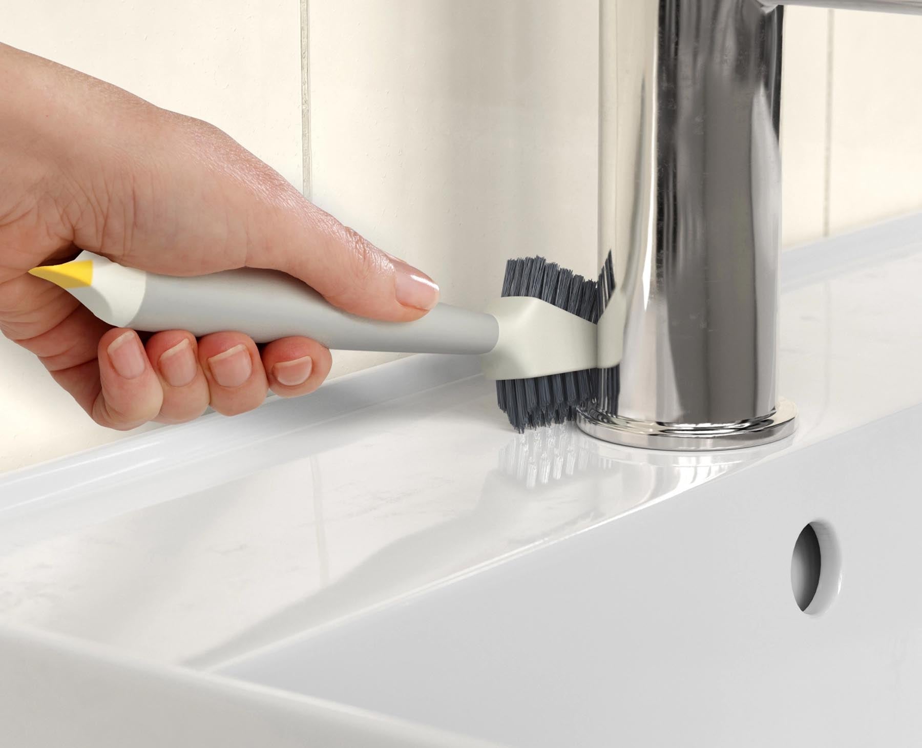 Praktische CleanTech 3-in-1 Reinigungsbürste in elegantem Lichtstein, ideal für gründliche Reinigung von Geschirr und Oberflächen.