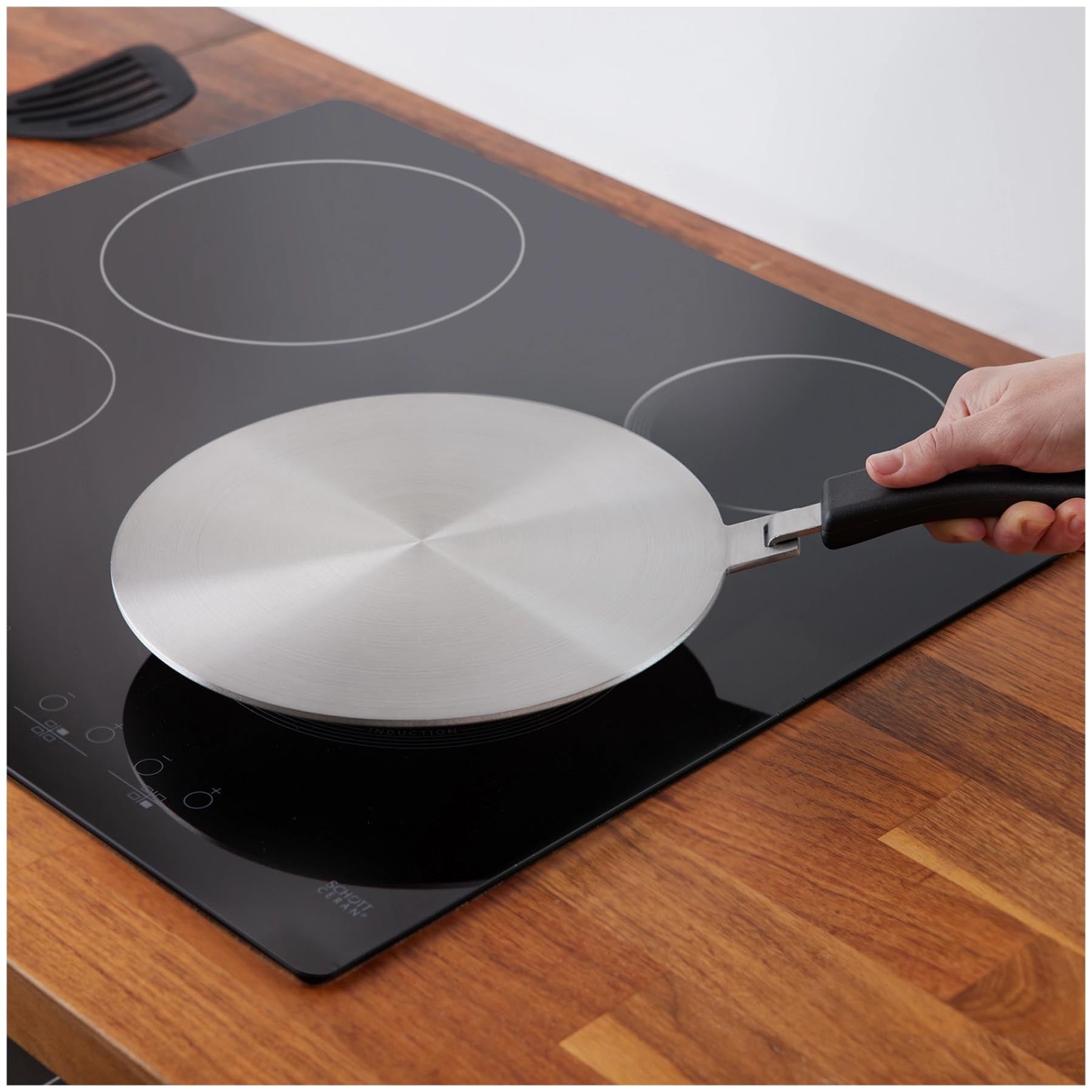 Praktische Induktionsadapterplatte von Westmark, Ø 28 cm, ermöglicht das Kochen auf Induktionsherden mit herkömmlichem Kochgeschirr.