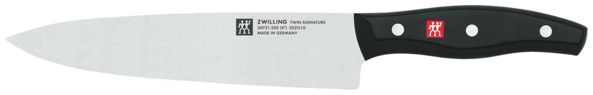 Zwilling Signature Messerblock aus Birkenholz mit fünf Edelstahlmessern, Vielzweckschere und Tranchiermesser, Griffe im Drei-Nieten-Design.