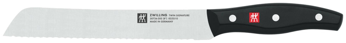 Zwilling Signature Messerblock aus Birkenholz mit fünf Edelstahlmessern, Vielzweckschere und Tranchiermesser, Griffe im Drei-Nieten-Design.