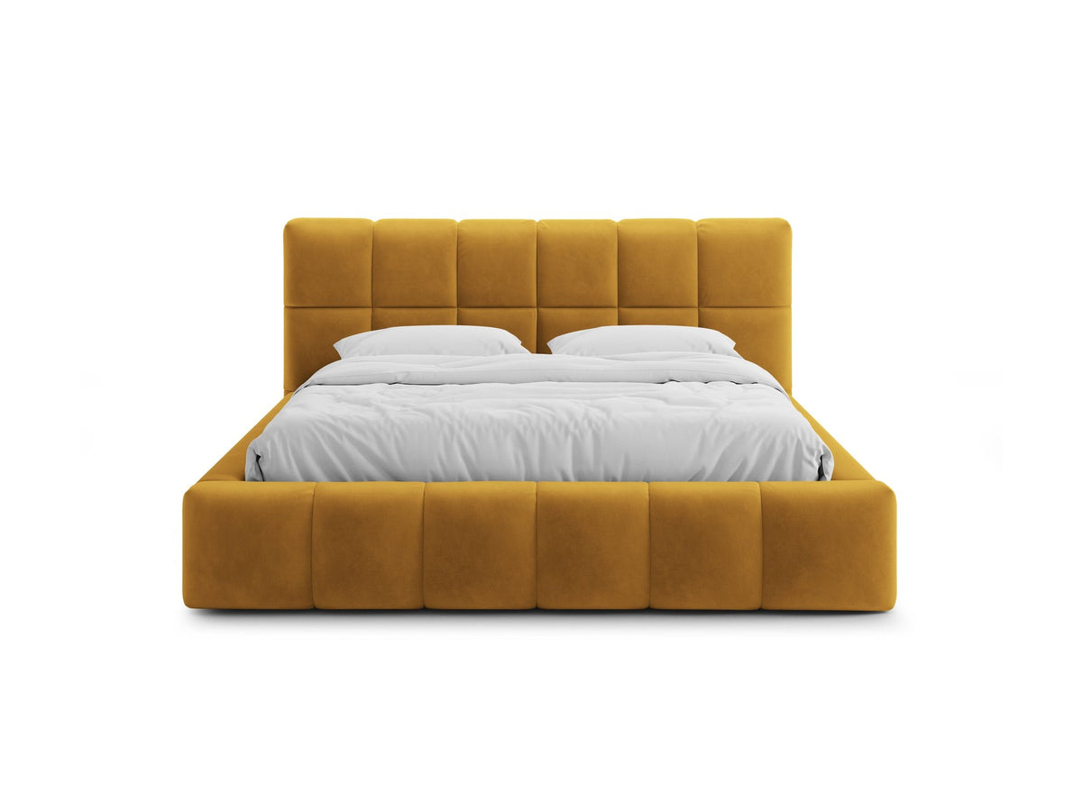 Bellis Ablagebett mit Kopfteil von Micadoni in Gelb, Bezug aus Bluvel-Stoff, schwarze Kunststoffbeine, gepolstertes Kopfteil mit Ziernähten.