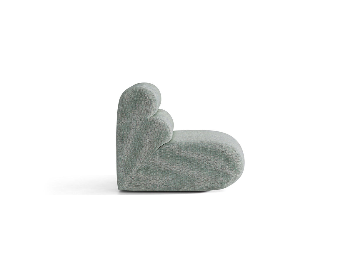 Armloses Samtmodul-Sofaelement Neo von Micadoni in dunklem Olivgrün, mit schwarzen Kunststoffbeinen, Teil eines modularen Sofasystems.
