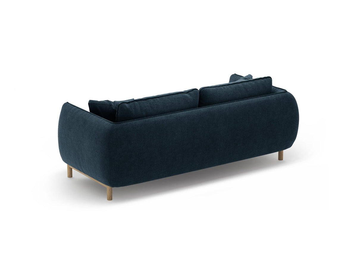 Ada 2er Sofa von Micadoni in Mandel beige mit gepolstertem Velours-Bezug, geschwungener Rückenlehne und sichtbaren Buchenholzbeinen.