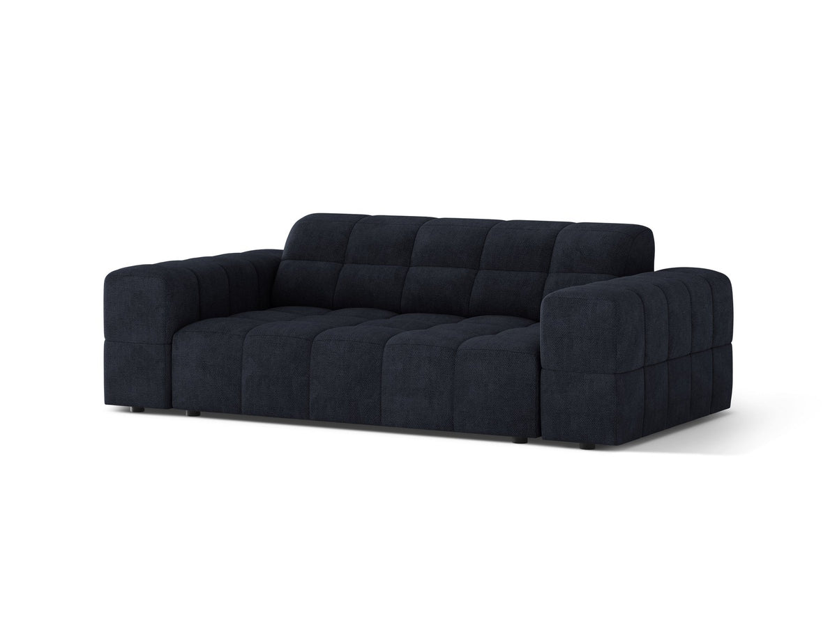Beiges 2er Sofa Jennifer von Micadoni mit Chenille-Bezug, schwarzen Kunststoffbeinen und gepolsterter Rückenlehne auf hellem Hintergrund fotografiert.