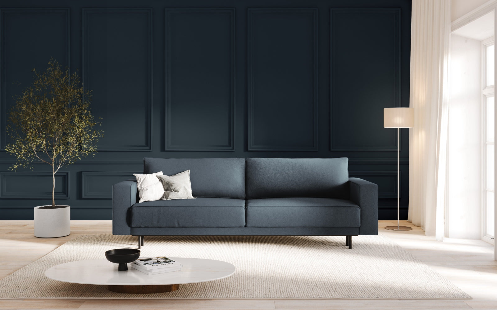Elegantes Caro Sofa in Blau mit Schlaffunktion und praktischem Stauraum, ideal für stilvolle Wohnräume und Gästeübernachtungen.