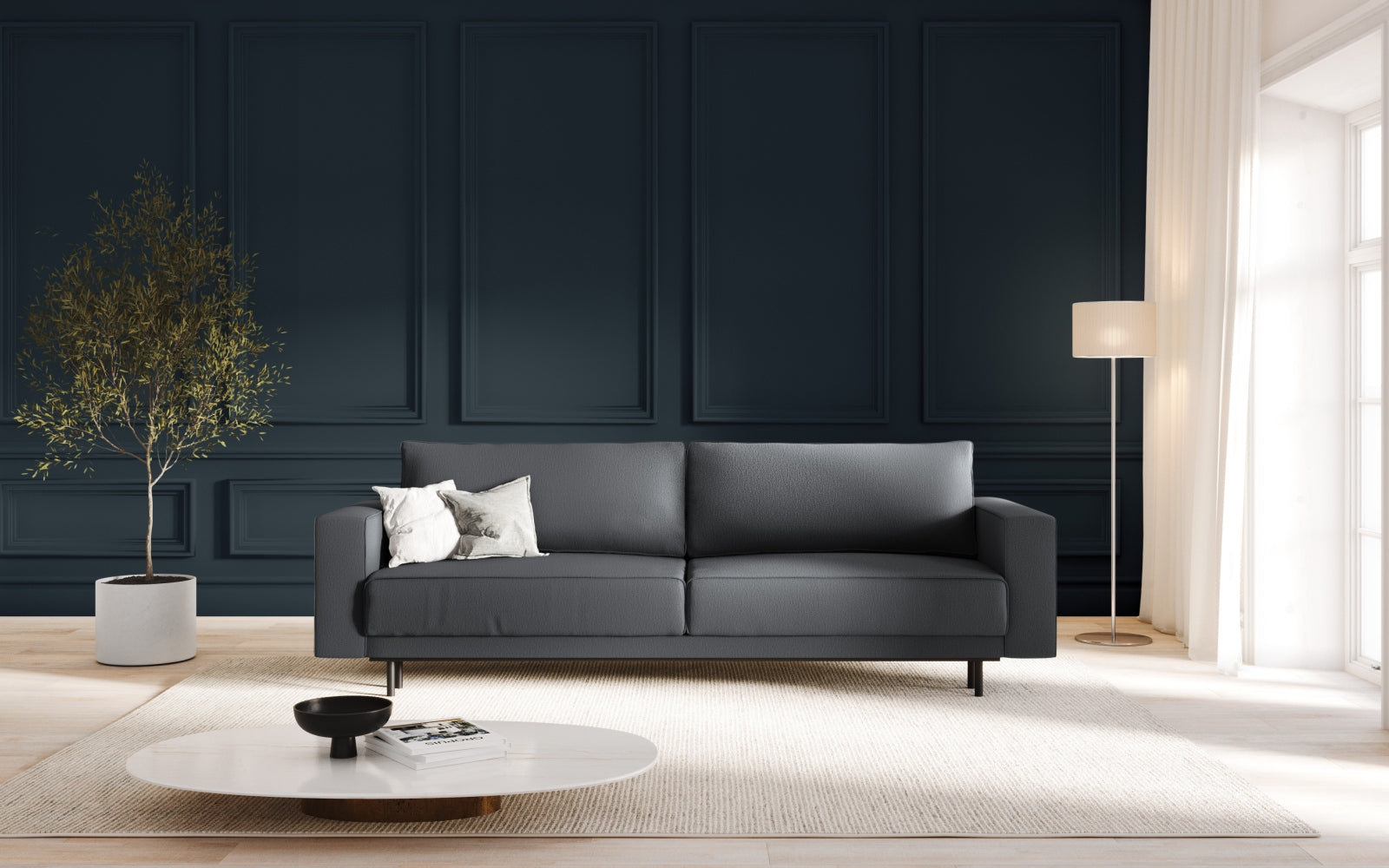 Elegantes Caro Sofa in Dunkelgrau mit Schlaffunktion und praktischem Stauraum, ideal für modernes Wohnen und Gästeübernachtungen.