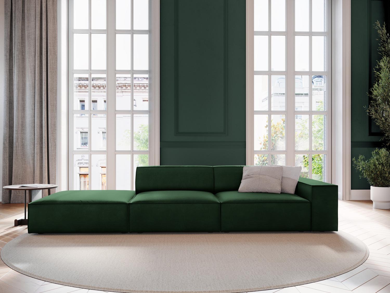 Elegantes Jodie Velour Sofa in Flaschengrün, modulares Design, ideal für stilvolle Wohnräume, präsentiert in einer gemütlichen Atmosphäre.