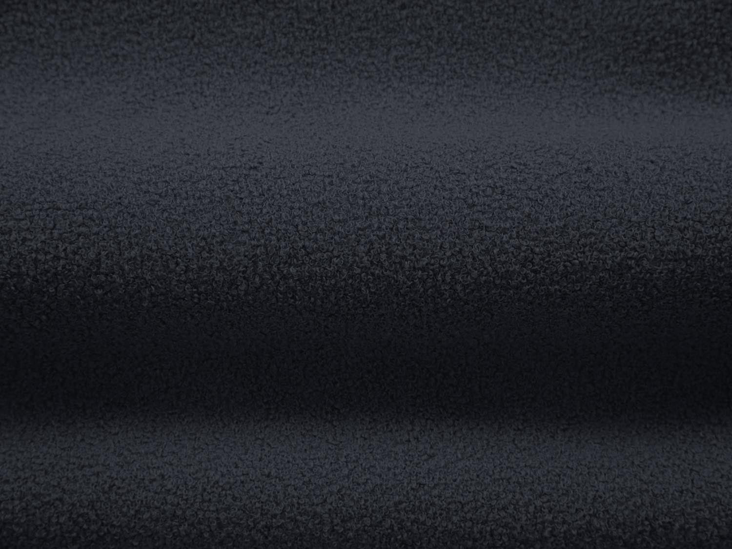 Elegantes 4-Sitzer Jenny Boucle Sofa in tiefblau, ideal für stilvolle Wohnräume und entspannte Stunden mit Freunden oder Familie.