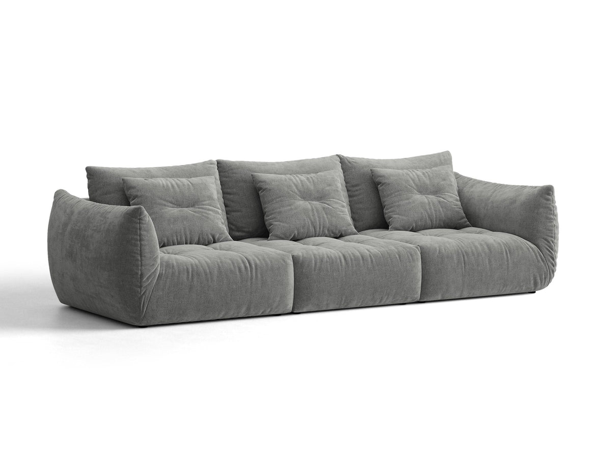 Modulares 4er Sofa Bloom von Micadoni in leichtem Beige, Bezug aus Casino-Velours, schwarze Kunststoffbeine, gepolsterte Rückenkissen.