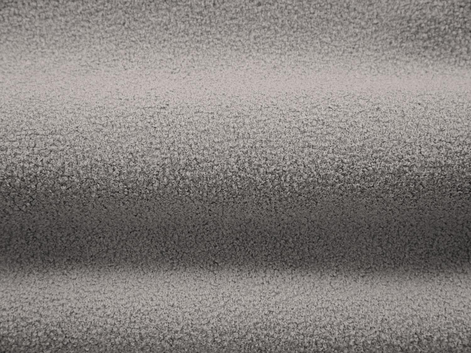 Stylischer Drehsessel Chuck Swivel Boucle in sanftem Grau, perfekt für entspannte Momente und moderne Wohnräume.