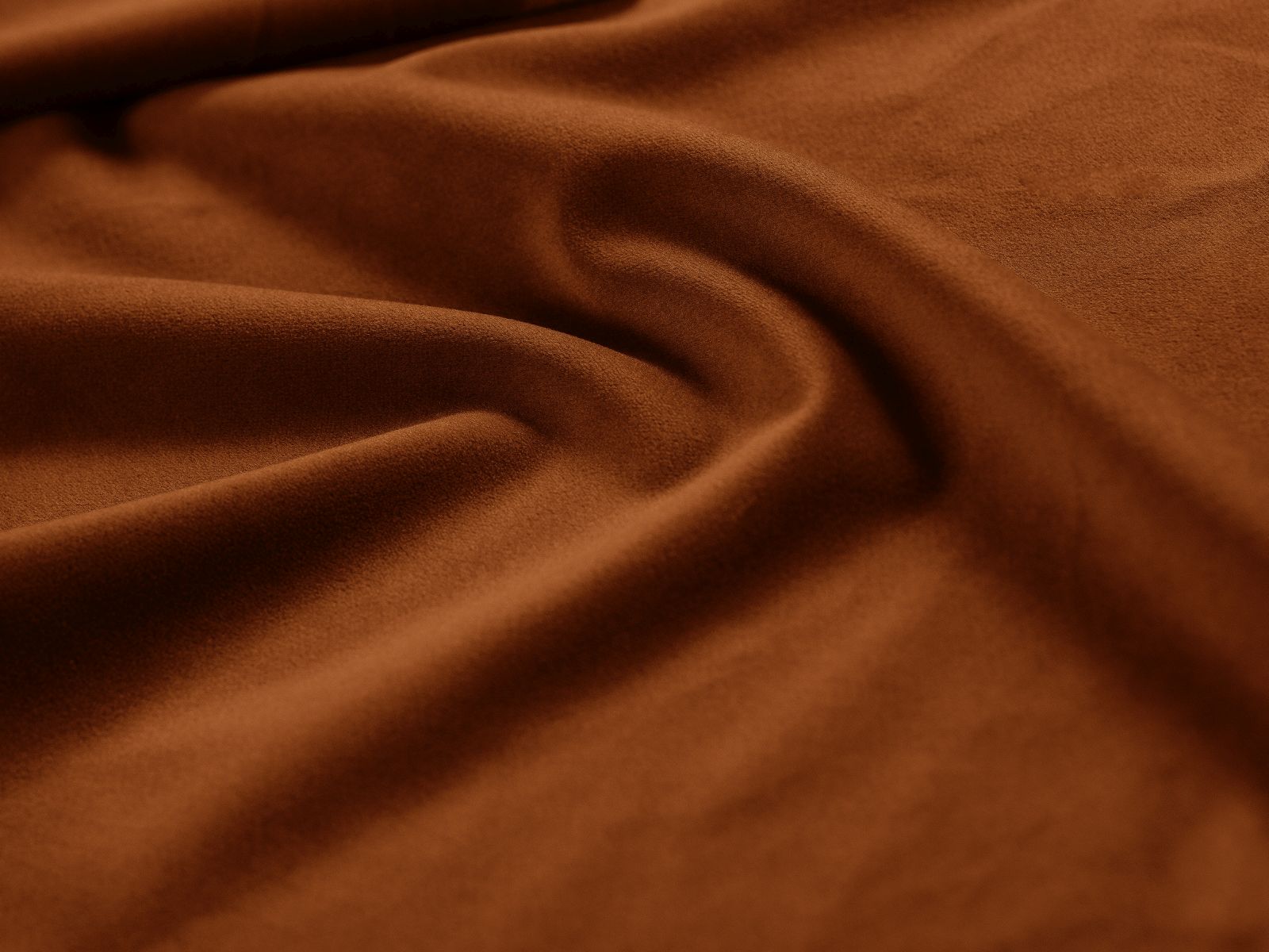 Moderner Drehsessel Letizia in ansprechendem Terracotta, perfekt für gemütliche Leseecken und stilvolle Inneneinrichtungen.