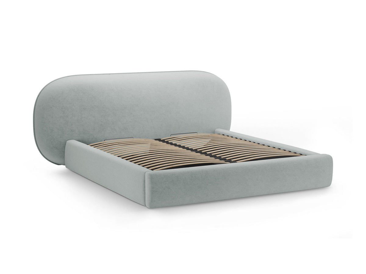 Stauraumbett Ovalo von Micadoni in Light Grey-Magic Velvet mit gepolstertem Kopfteil, Metallrahmen, Bettkasten und schwarzen Kunststoffbeinen.