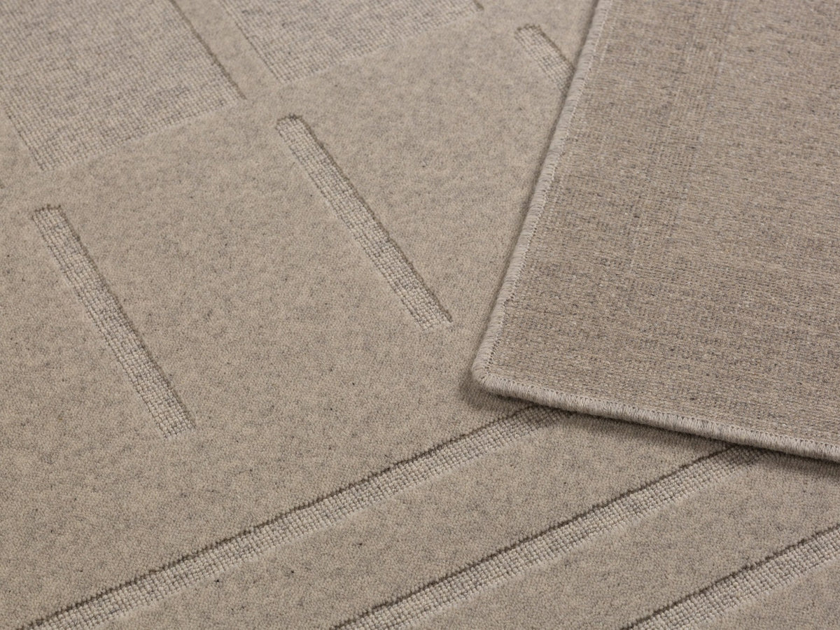 Hellgrauer Teppich Kasai von Micadoni aus Wolle, Grösse 230x160 cm, mit dichtem Flor und sauber verarbeiteten Kanten.