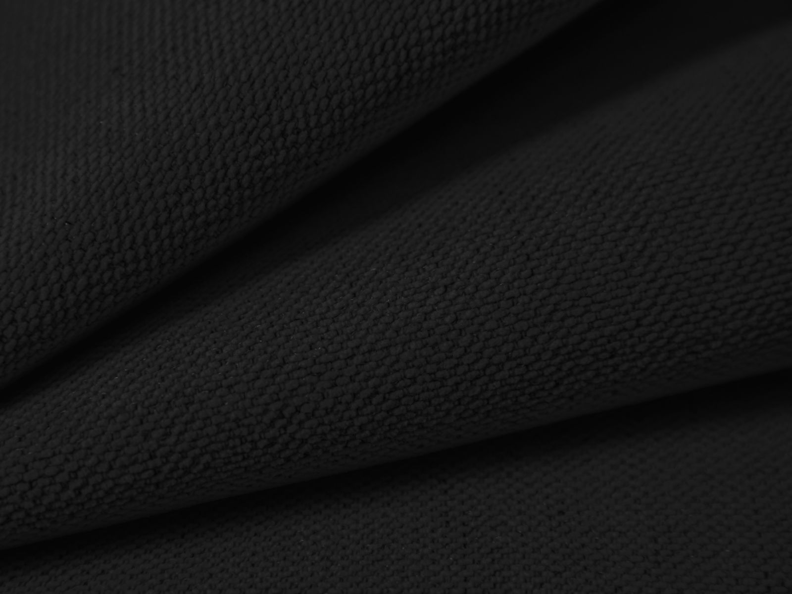 Modernes 3-Sitzer Ecksofa Victor in elegantem Schwarz, ideal für entspannte Abende und bietet praktischen Stauraum für Kissen und Decken.