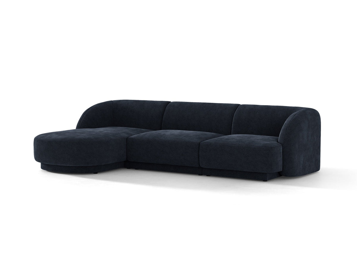 Miley Linkes Ecksofa von Micadoni, L-Sofa links in Dunkelbeige mit Bluvel-Stoffbezug und schwarzen Kunststoffbeinen, Frontalansicht.