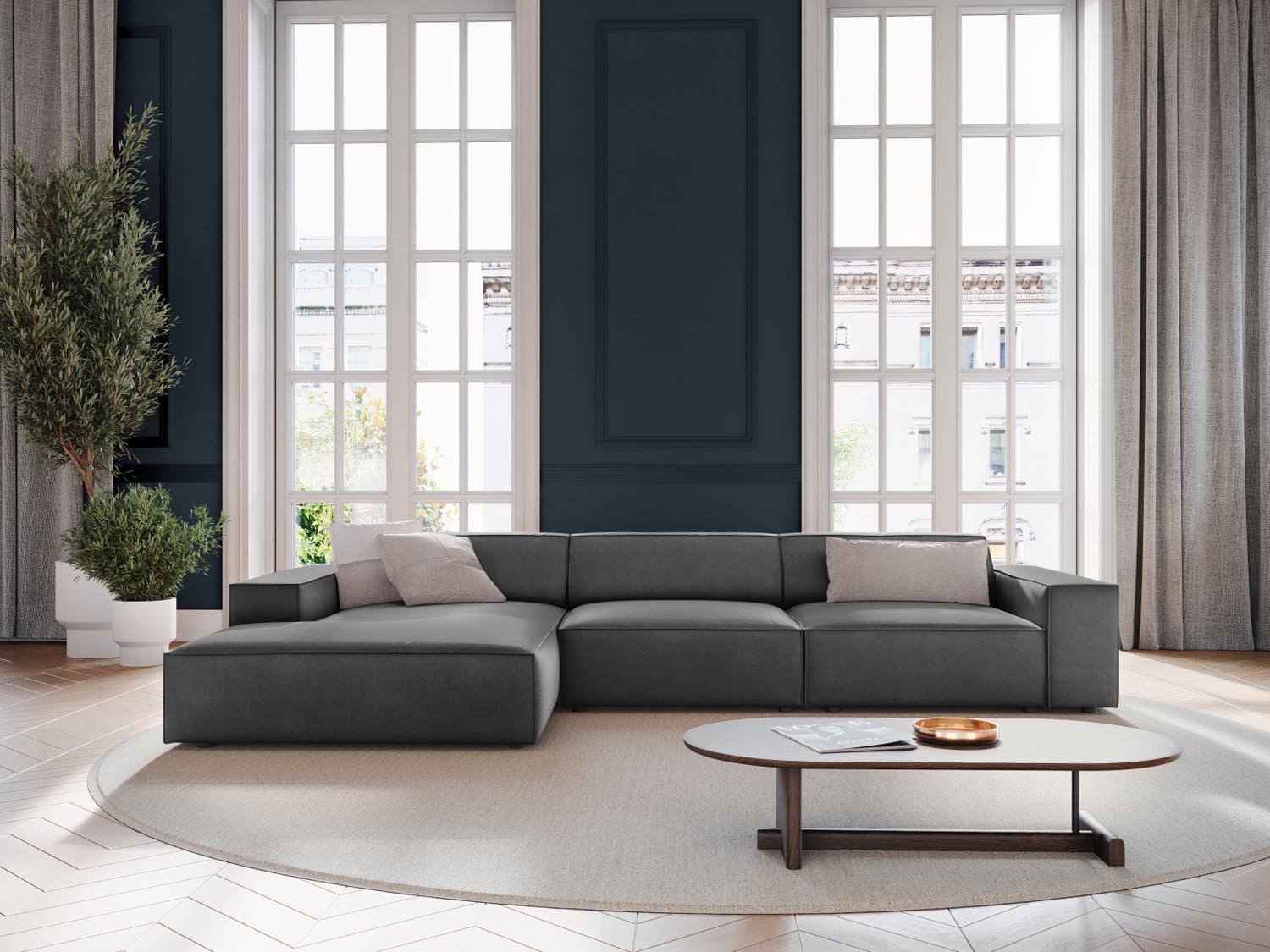 Elegantes Jodie Velour Ecksofa in Grau-Blau, modulares Design, ideal für stilvolle Wohnräume, präsentiert in gemütlicher Atmosphäre.
