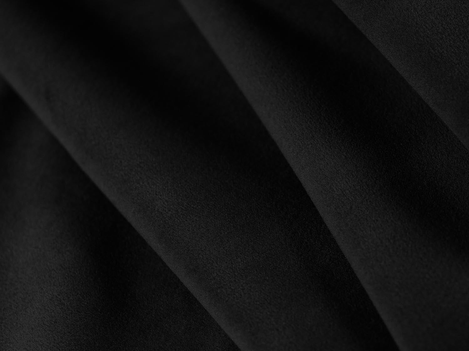 Eleganter Bellis Velour Pouf in luxuriösem Schwarz-Bluvel, 94 cm Durchmesser, ideal für stilvolle Wohnräume und gemütliche Sitzmöglichkeiten.