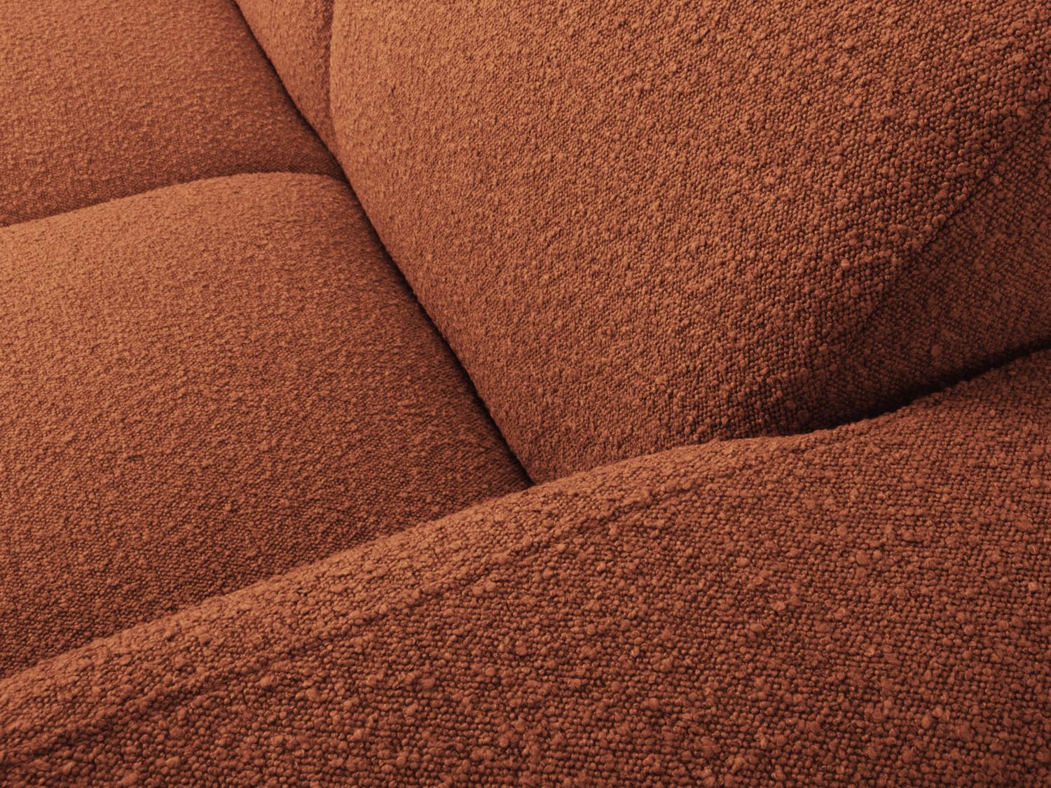 Elegantes 4-Sitzer Ecksofa Molino Boucle in sanftem Terracotta, rechtsseitig, ideal für stilvolle und einladende Wohnräume.