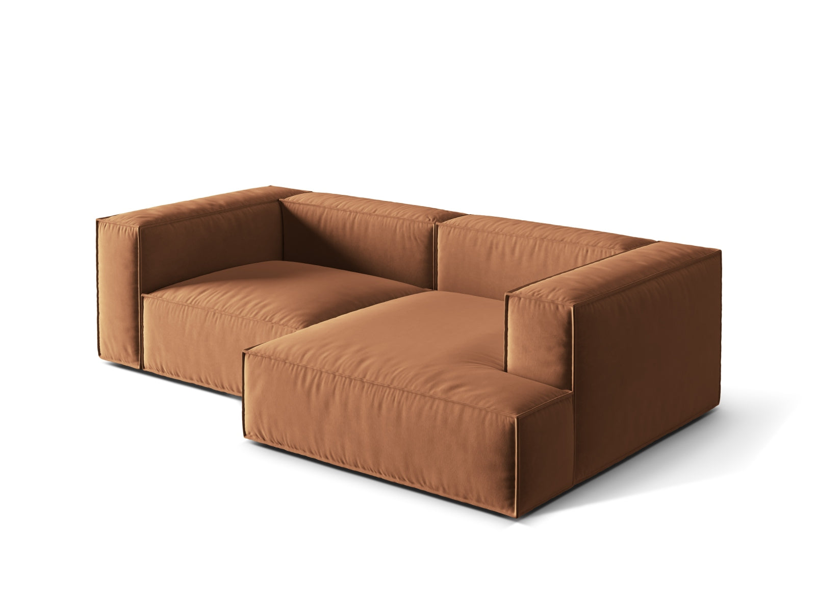 Modulares Nuria Velour Ecksofa in warmem Honigton, bietet Komfort und Stil für jedes Wohnzimmer. Ideal für gesellige Abende und entspannte Stunden.