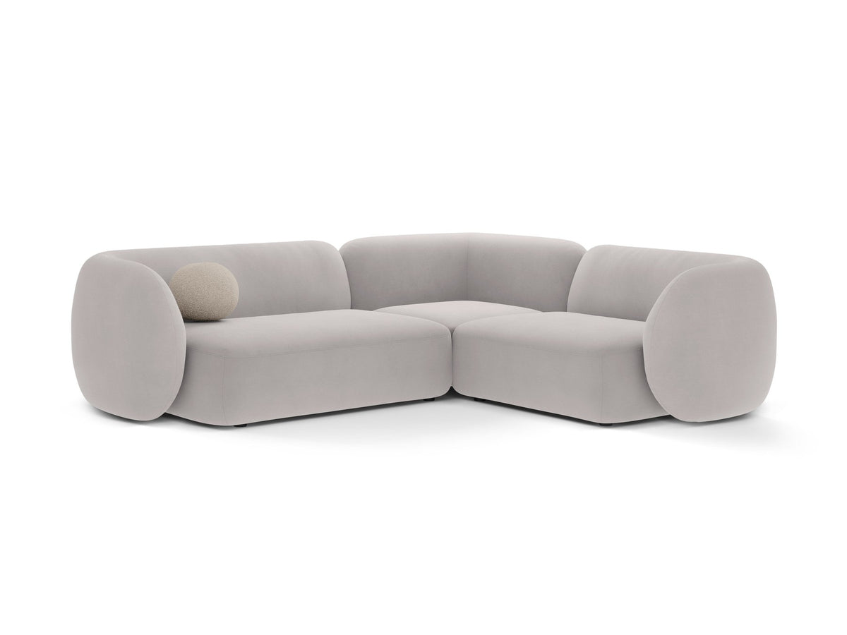 Weisses Ecksofa rechts von Micadoni aus der Kate-Serie mit strukturiertem Bouclé-Stoff, schwarzen Kunststoffbeinen und modularem Aufbau.