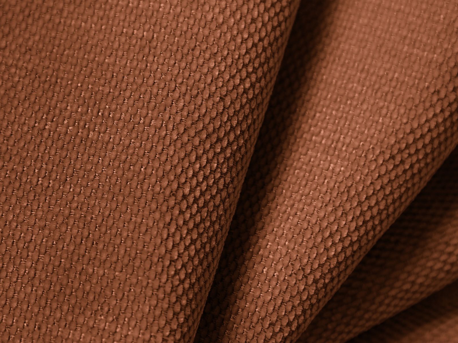 Elegantes 6-Sitzer Ecksofa Molino in strahlendem Orange, ideal für gemütliche Wohnräume, kombiniert Komfort mit zeitgemäßem Stil.