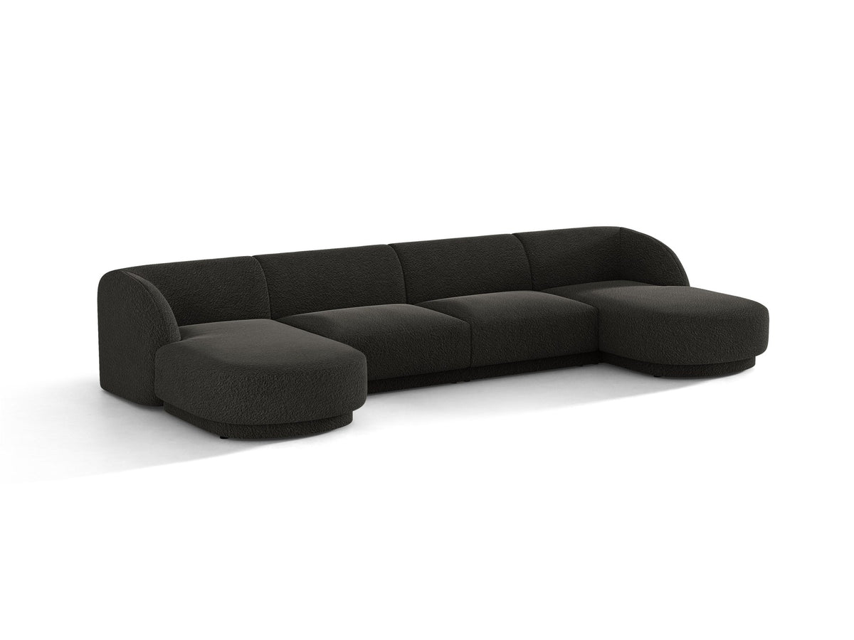 Dunkelbeiges Panorama-Ecksofa Miley von Micadoni mit Bluvel-Stoffbezug, L-Form, schwarzen Kunststoffbeinen und niedriger Rückenlehne.