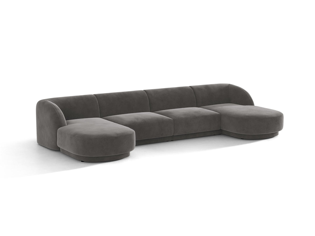 Dunkelbeiges Panorama-Ecksofa Miley von Micadoni mit Bluvel-Stoffbezug, L-Form, schwarzen Kunststoffbeinen und niedriger Rückenlehne.