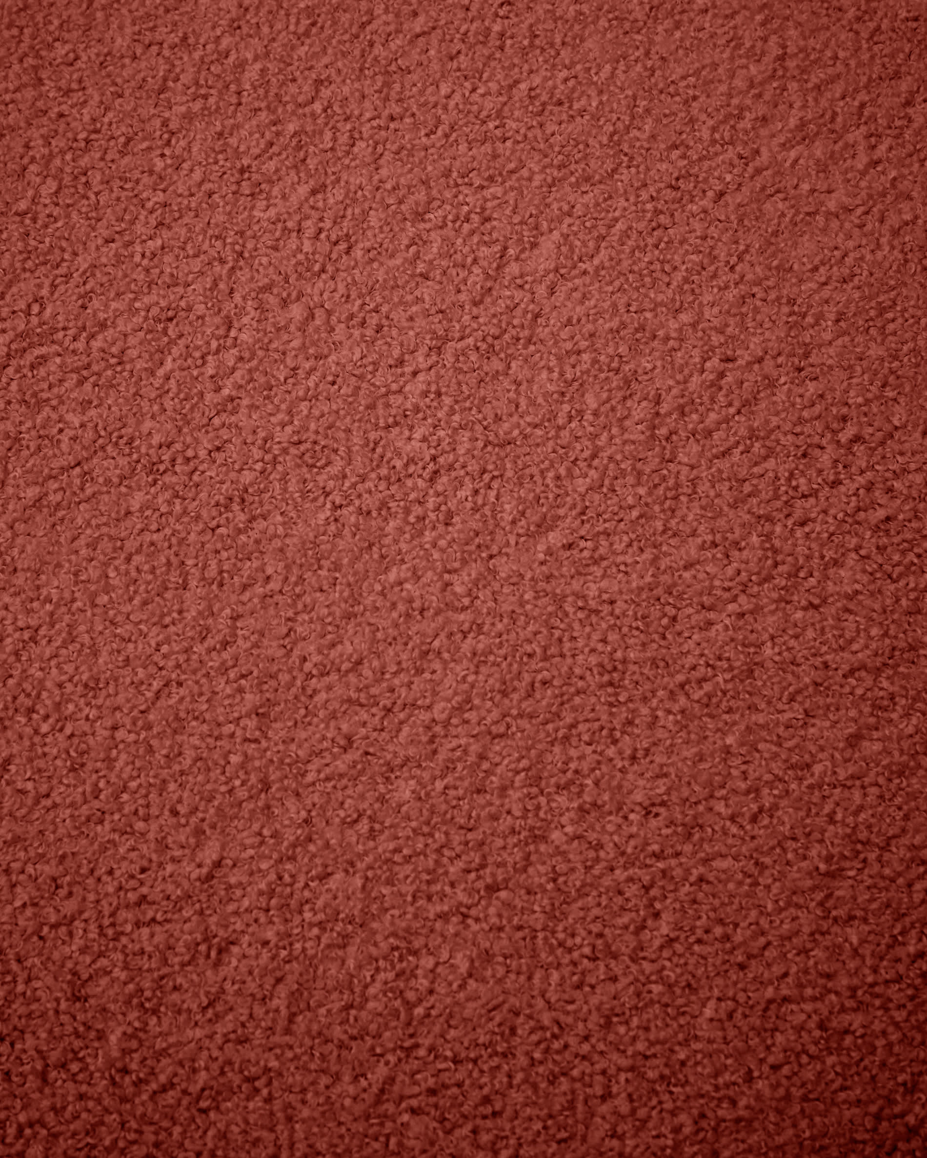 Eleganter Bezug für Fusshocker Kaeli in terrakottafarbenem Bouclé, Ø 90 cm. Hochwertig, nachhaltig und pflegeleicht für stilvolle Akzente.