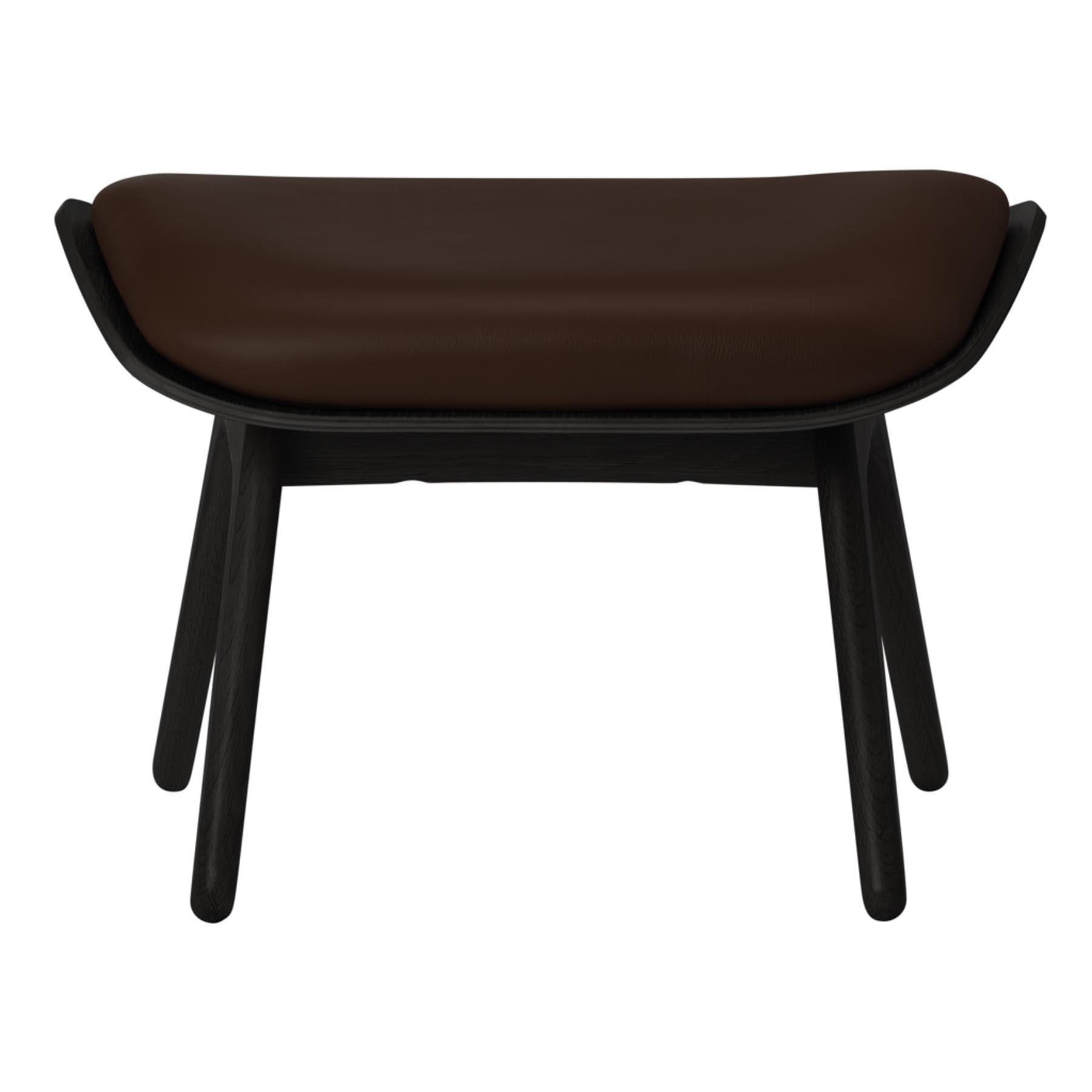 Eleganter Ottoman "The Reader" von Umage in einem warmen Braunton, ideal für gemütliche Leseecken und stilvolle Inneneinrichtungen.