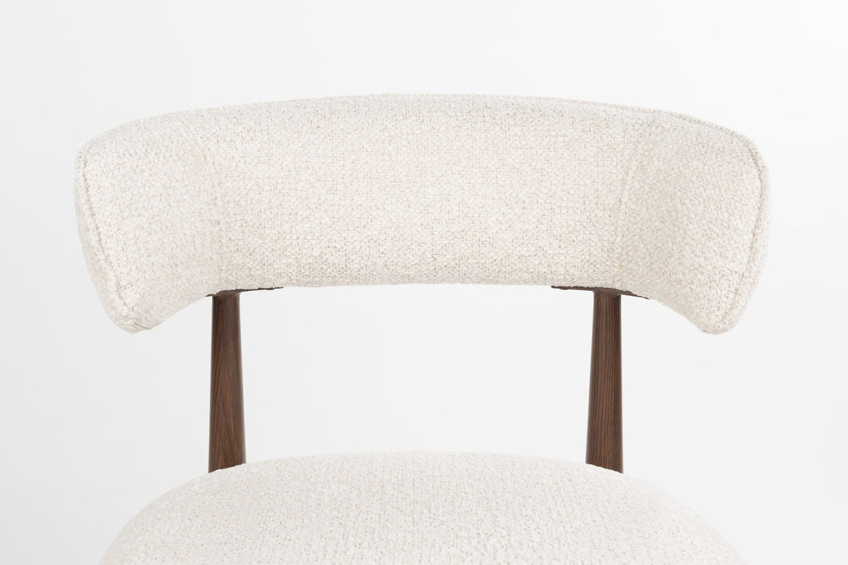 Gepolsterter Esszimmerstuhl Chair Stanley von White Label Living mit beigem Polyester-Bezug und braunem, pulverbeschichtetem Eisengestell.