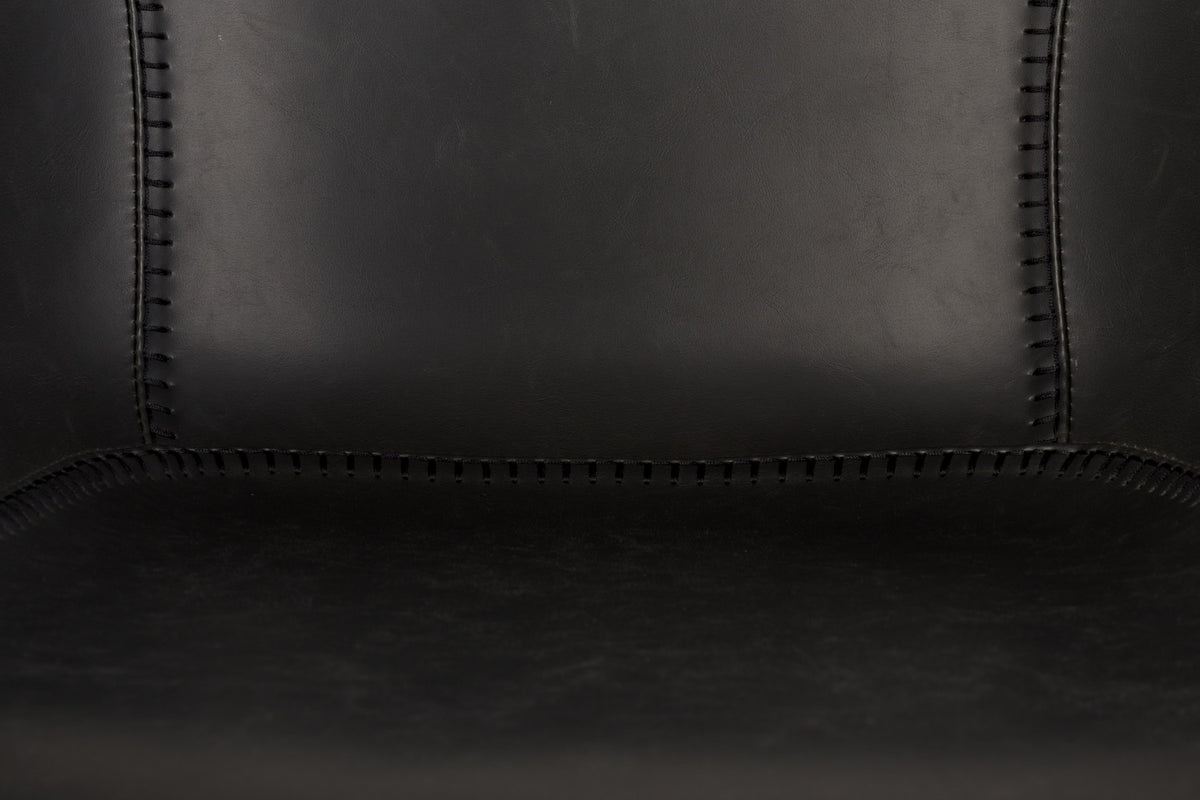 Armlehnstuhl Feston in Schwarz präsentiert im Onlineshop von KAQTU Design AG. Stuhl mit Armlehne ist von Zuiver