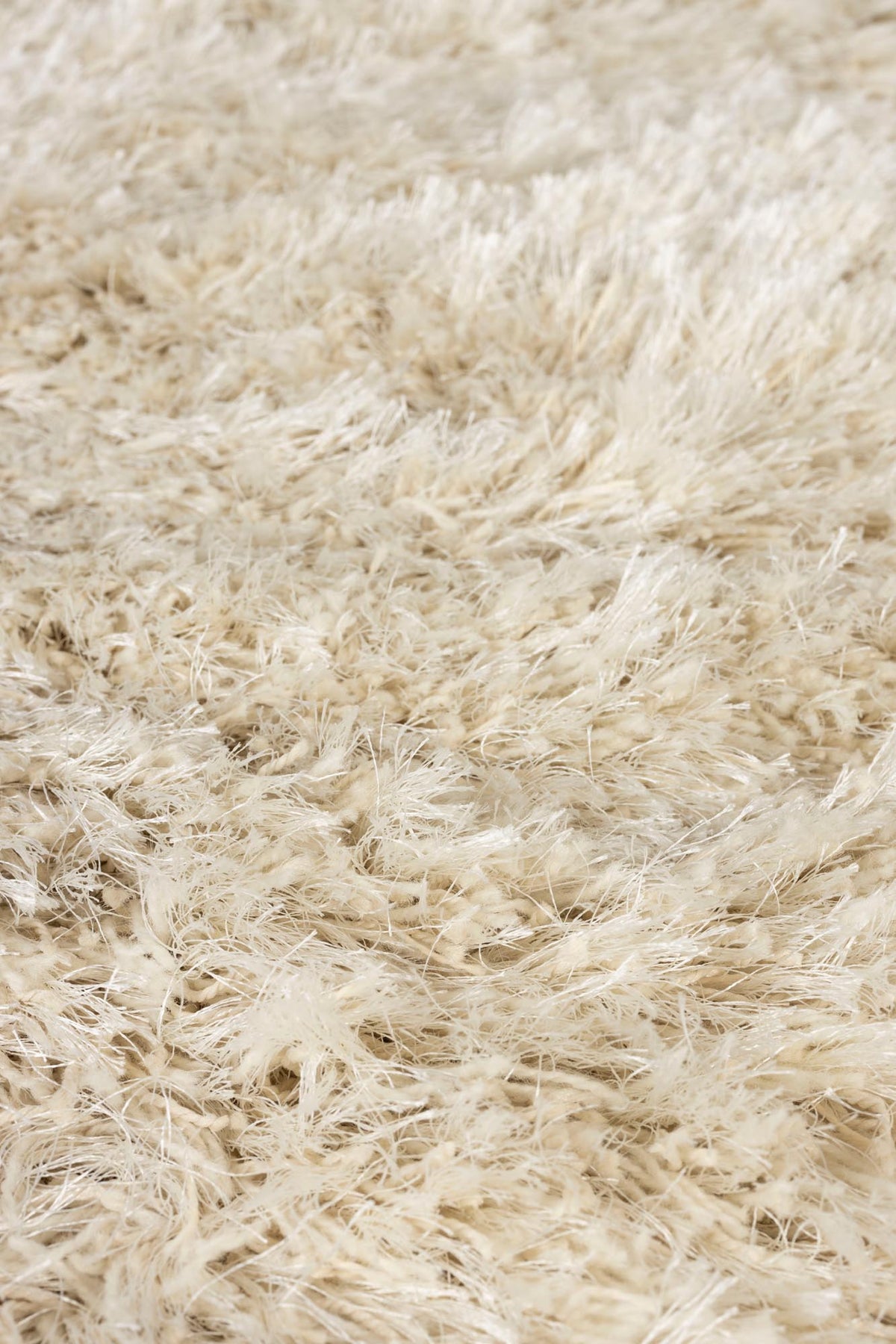 Beige Wollteppich Tasty von Zuiver mit organischer Form, hochflorige Oberseite und Rückseite aus Jute, im Innenbereich.