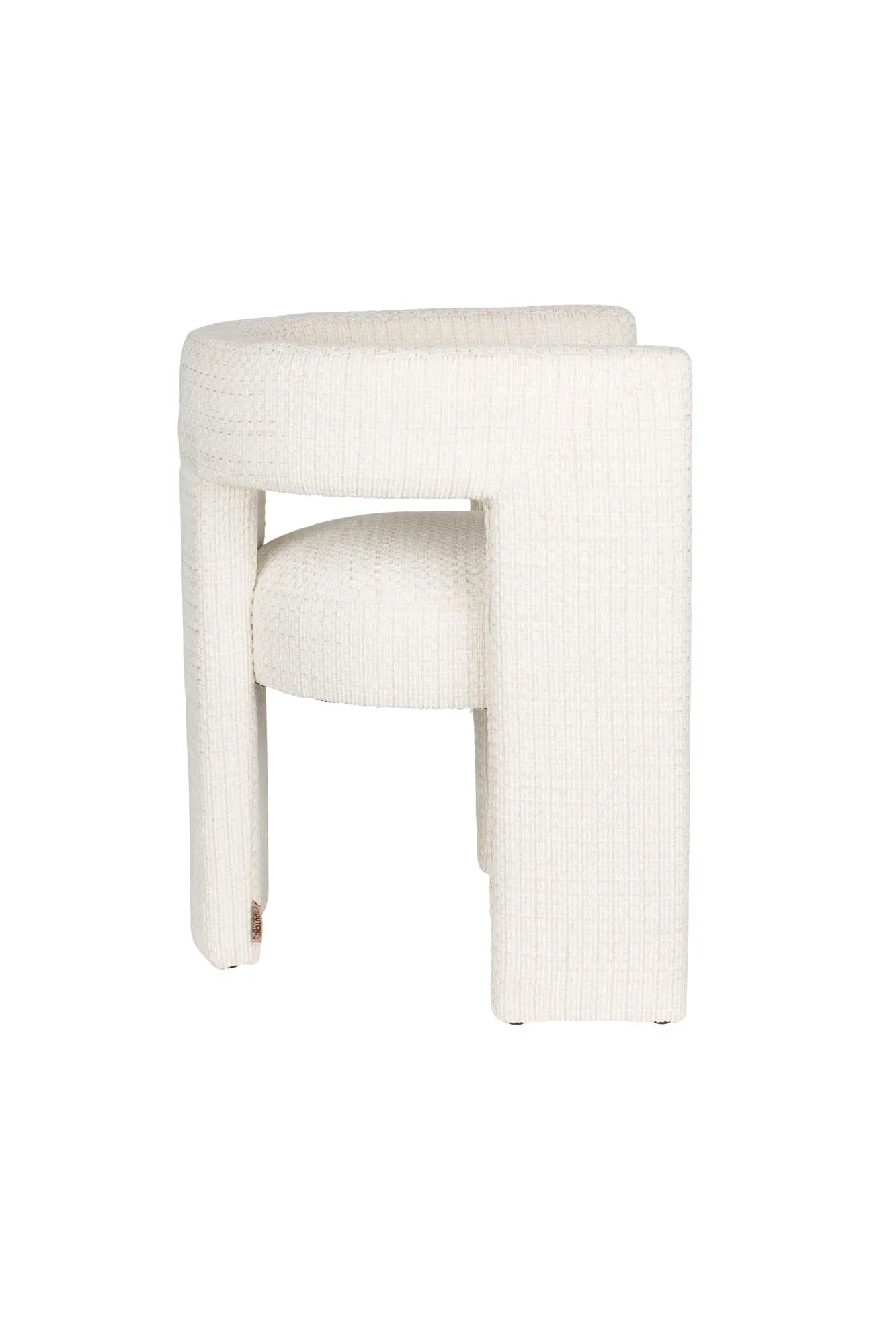 Eleganter Esszimmerstuhl mit gepolstertem Komfort, Vintage-Charme und innovativem dreibeinigem Design.