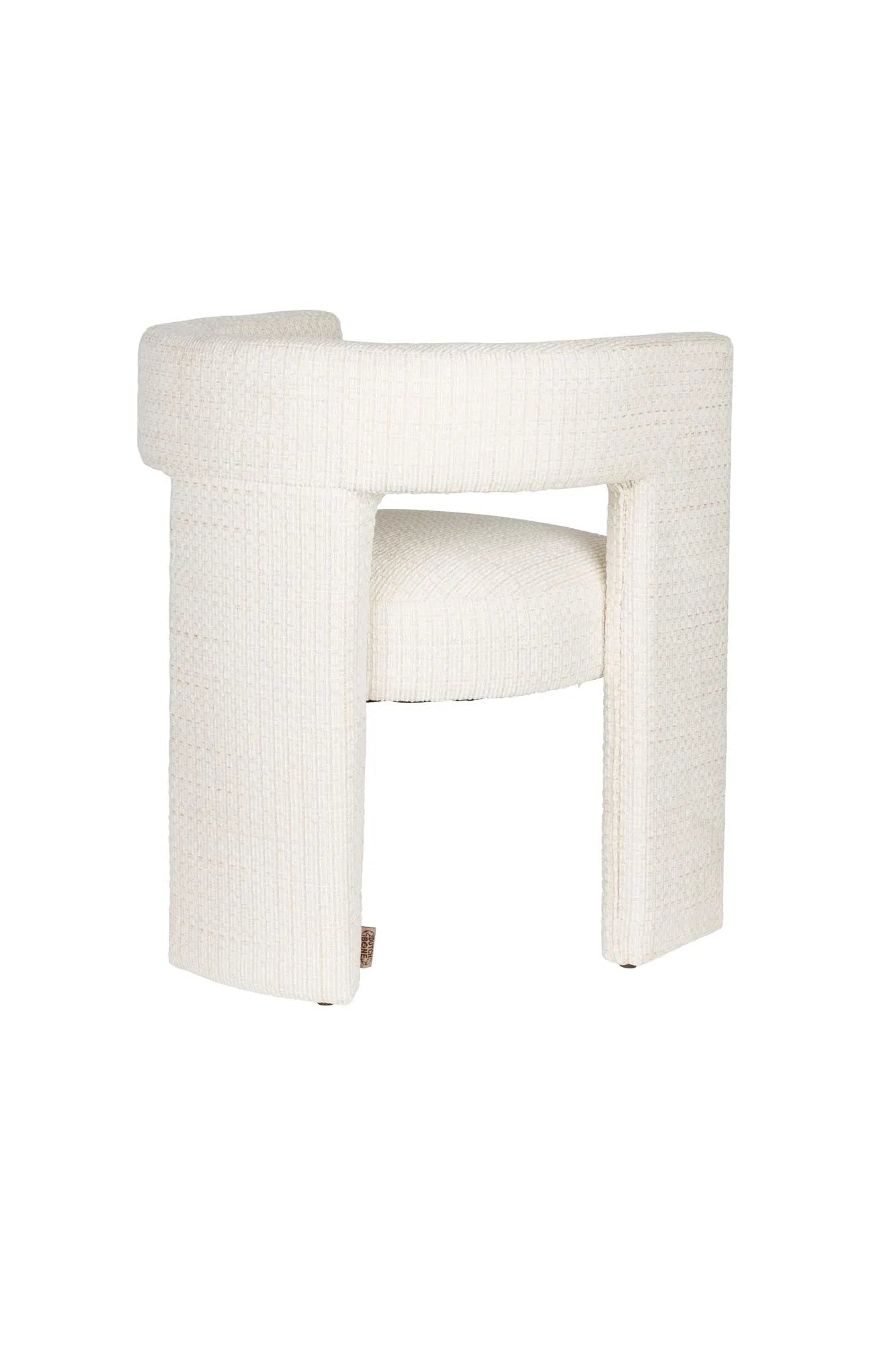 Eleganter Esszimmerstuhl mit gepolstertem Komfort, Vintage-Charme und innovativem dreibeinigem Design.