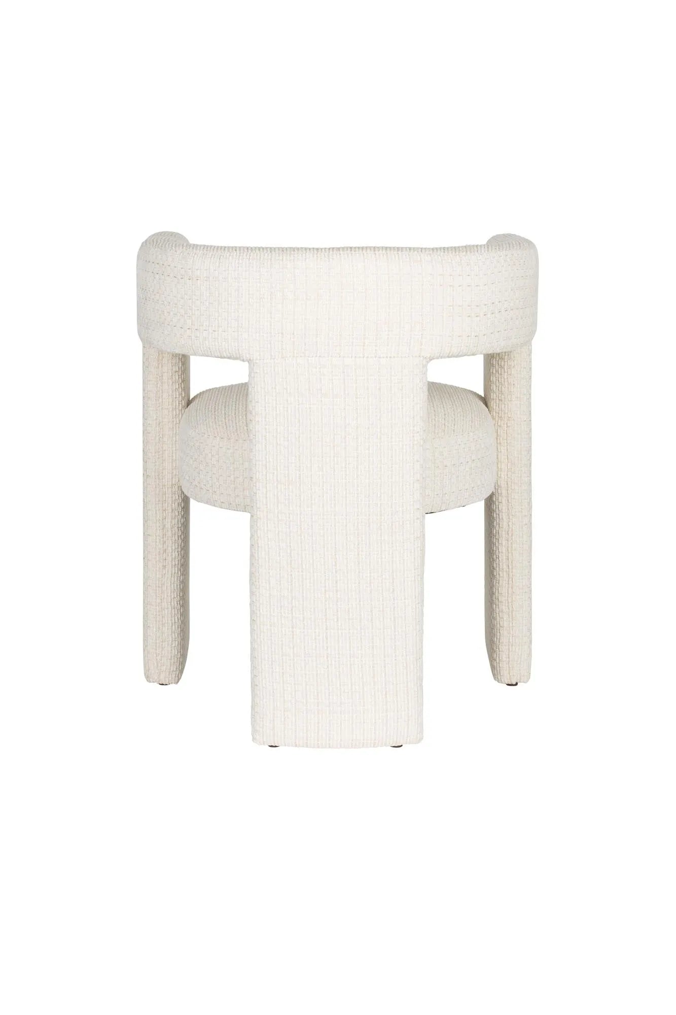 Eleganter Esszimmerstuhl mit gepolstertem Komfort, Vintage-Charme und innovativem dreibeinigem Design.