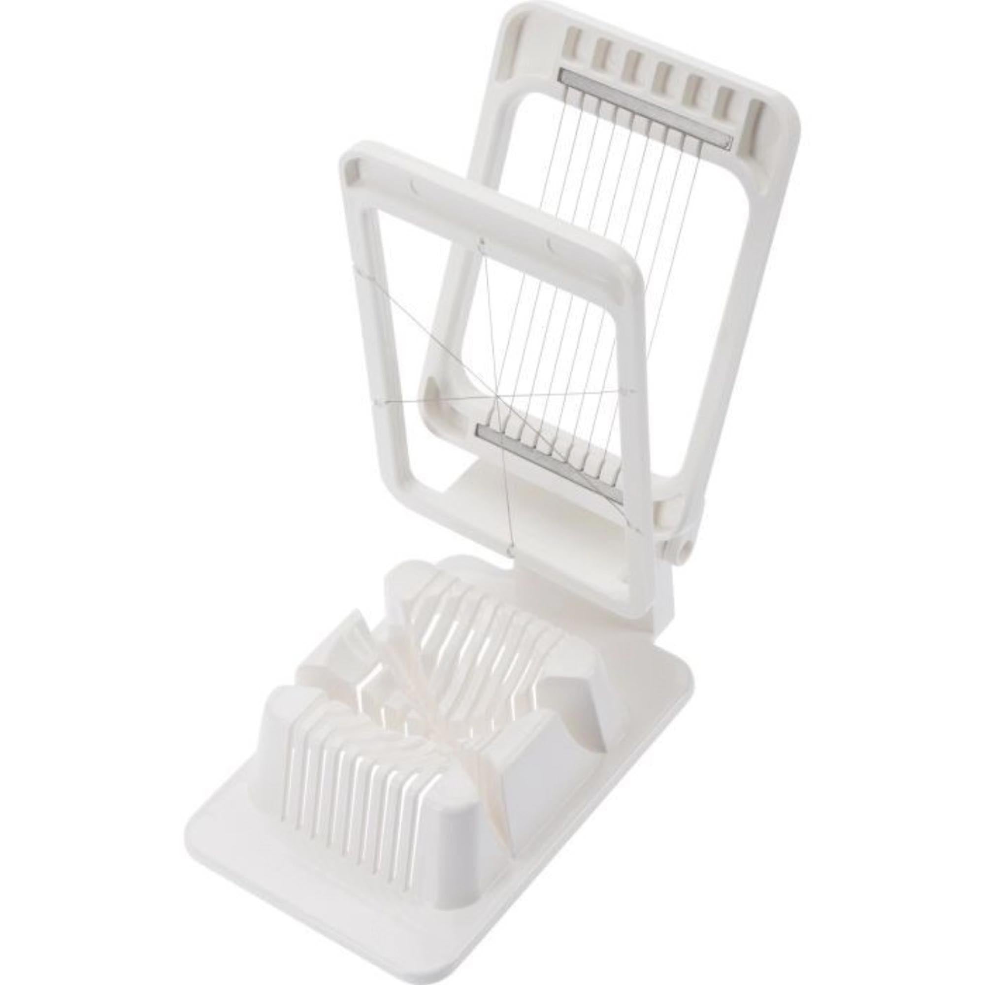 Kompakter Kombi-Eierteiler von Westmark, perfekt zum Schneiden und Teilen von Eiern, Maße: 13.5x8.5x4cm, praktisch und vielseitig.