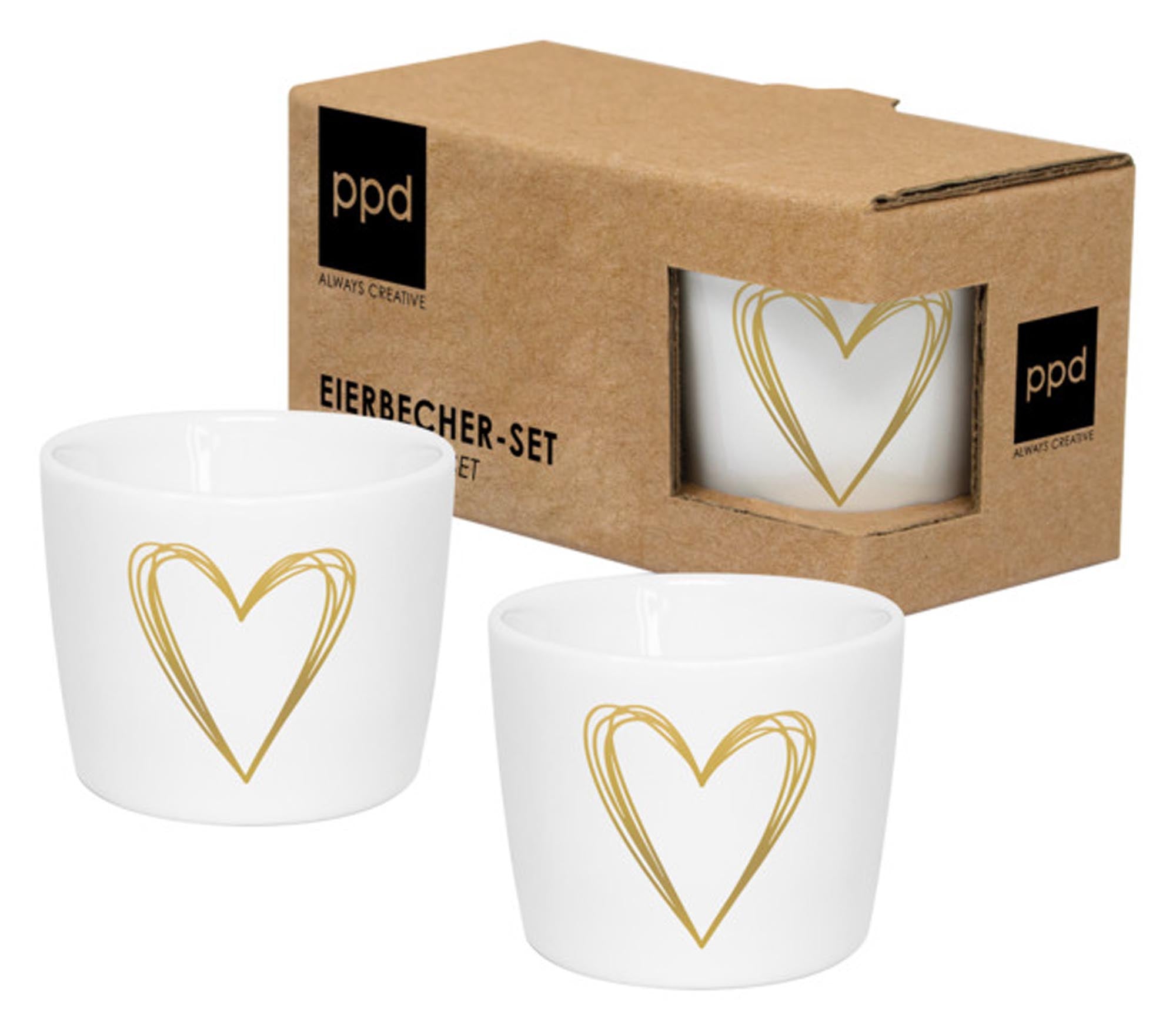 Elegante Eierbecher aus Porzellan mit goldenem Herz-Design, ideal für stilvolle Frühstücksmomente.