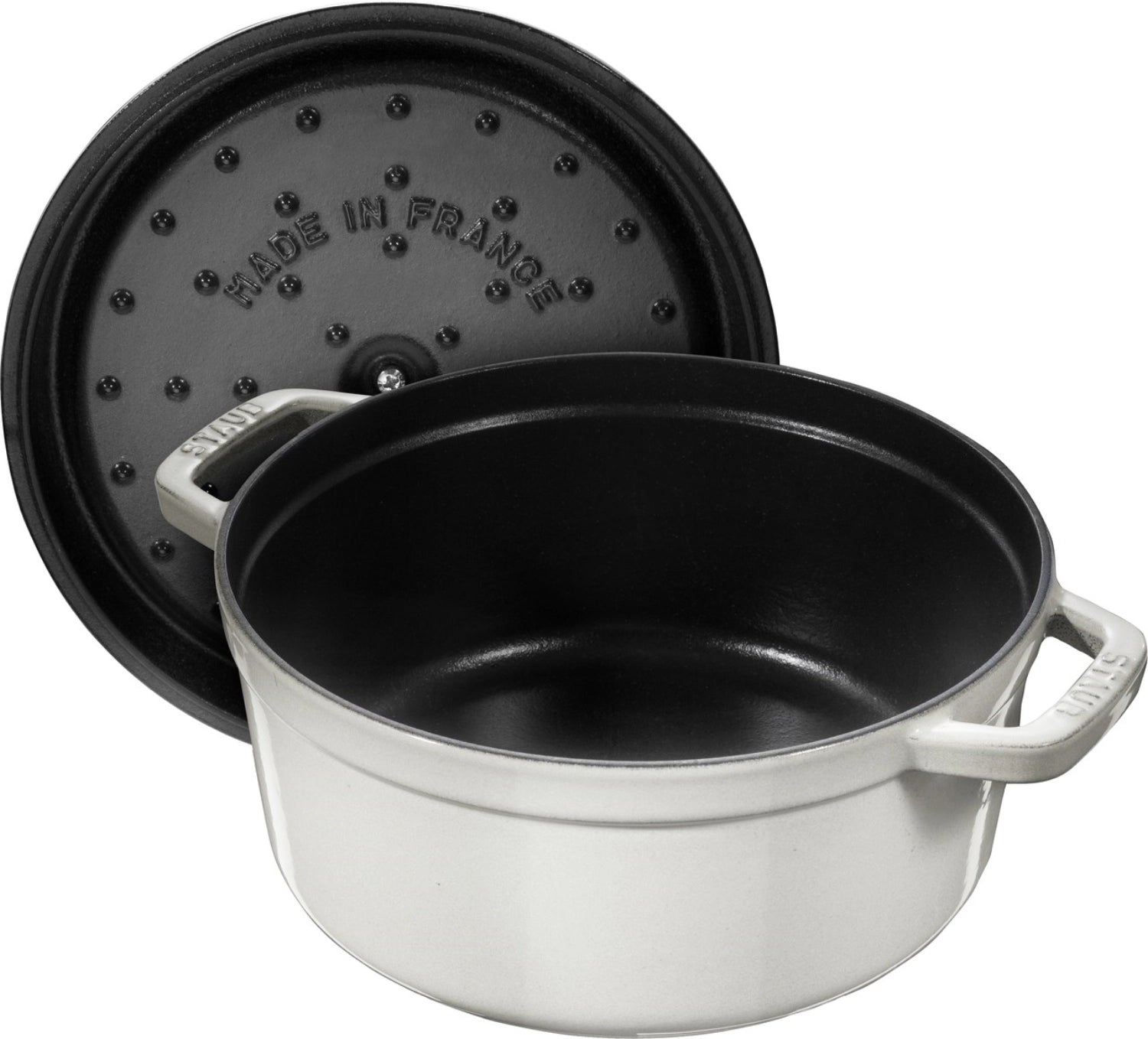 Elegante runde Cocotte von Staub, 20 cm, aus robustem Gusseisen, in luxuriösem Weiß mit Trüffel-Optik, perfekt für kreative Kochabenteuer.