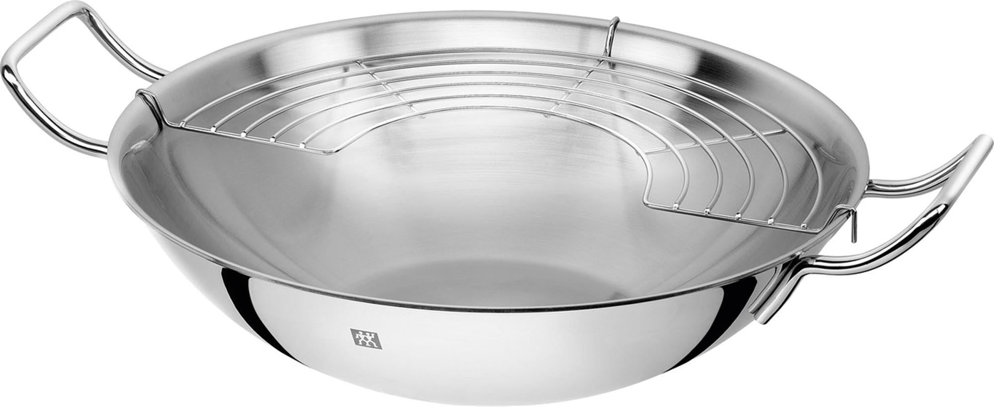 Erleben Sie mit dem Zwilling Plus Wok Ø32 cm erstklassige Kochkunst! Hochwertiger Edelstahl, optimale Wärmeverteilung und fettfreies Kochen für gesunde Gerichte.