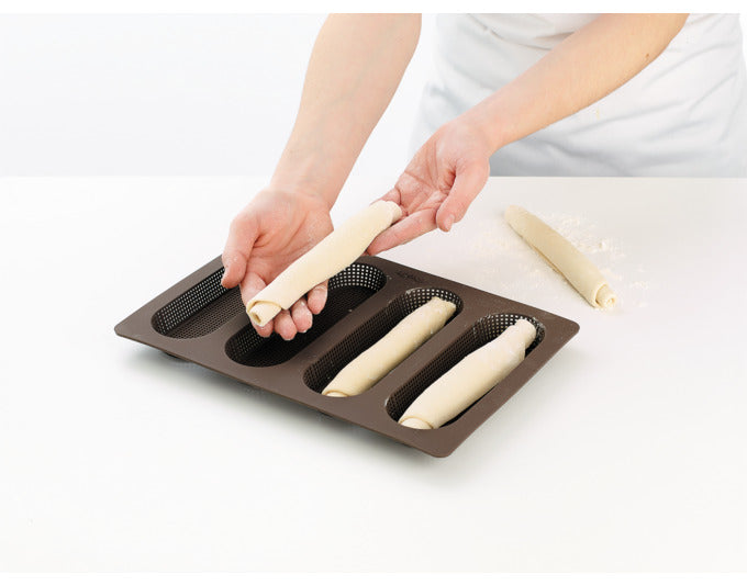 Mini-Baguette-Backform aus Silikon von Lékué, ideal für 4 kleine Baguettes, 29x20 cm, antihaftend und leicht zu reinigen.