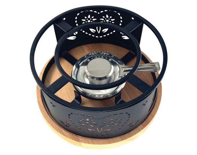 Das HEIDI Rechaud Maxi Coeur Folk ø 21 cm besticht durch sein charmantes Design und ist ideal für gesellige Fondue-Abende.