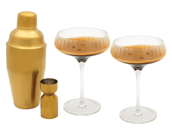 Elegantes 4-teiliges Cocktail-Set aus Glas und goldfarbenem Edelstahl, ideal für stilvolle Drinks und besondere Anlässe.