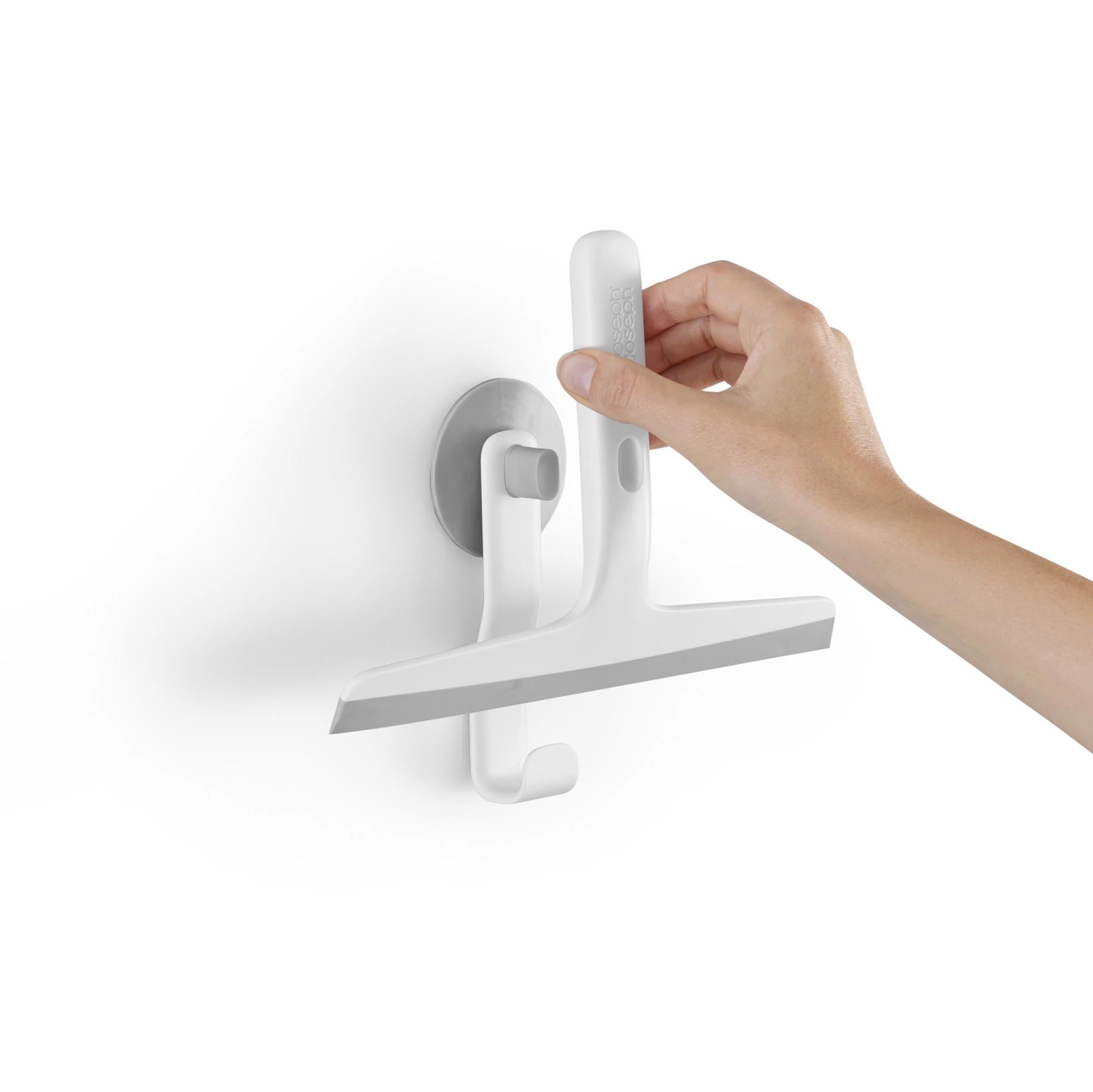 Platzsparender EasyStore Abzieher mit Wandhalterung von Joseph Joseph.