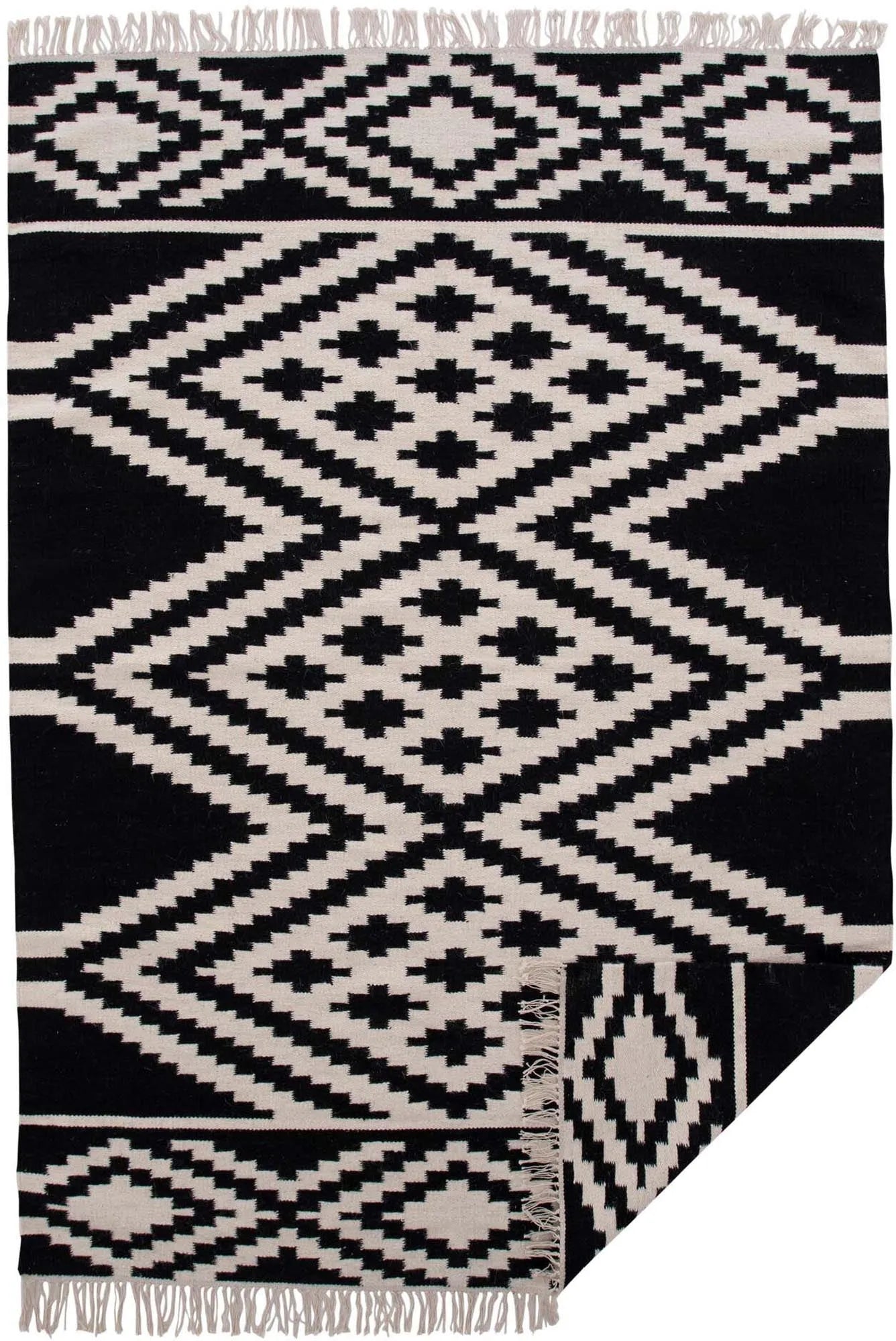 Indari Teppich in Schwarz präsentiert im Onlineshop von KAQTU Design AG. Teppich ist von Venture Home